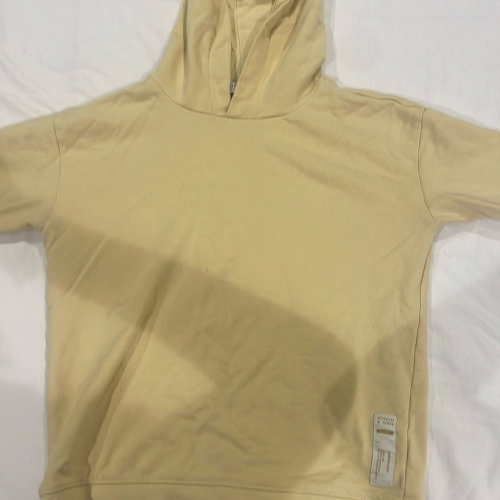 This is a kids size scotch and soda hoodie with minor flaws.